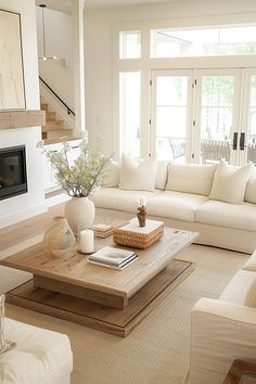 a living room filled with furniture and a fire place