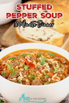 a bowl of stuffed pepper soup with bread in the background and text overlay that says stuffed pepper soup 30 minute dinner