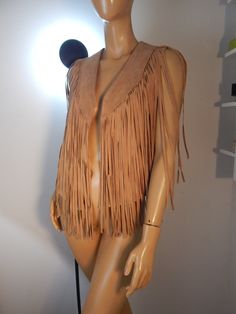 suede fringe vest with bust appx 40 vest length 30 fringe length 20 tons of fringe braiding around lapel really nice quality with label removed looks new but is totally western and rustic Fitted Sleeveless Outerwear For Festival, Bohemian Sleeveless Fitted Outerwear, Fall Festival Vest With Fringe, Sleeveless Western Outerwear For Fall, Bohemian Fringe Vest For Festivals, Bohemian Fringe Vest For Spring, Fitted Fringe Vest For Festivals, Fitted Fringe Vest For Festival, Fitted Fringe Vest For Summer