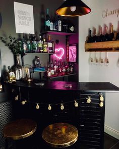 a bar with two stools in front of it