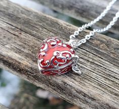 This heart locket necklace is perfect for anyone! It is silver with red enamel and a scrolling silver design on the top. It has a little hook on one side and it can be opened up and you can put whatever you want inside. It's about 4 mm deep inside x 14mm wide. These would be great for any time of the year! This is a wonderful gift for a wedding, bride or bridesmaid gift, for a Christmas gift, for Mother's Day, or a birthday. This listing is for one chain and pendant. Red Locket Necklace, Locket Necklace Vintage, Red Heart Necklace, Prayer Box, Heart Locket Necklace, Red Pendants, Heart Box, Necklace Red, Silver Design