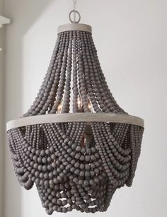 a gray chandelier hanging from the ceiling