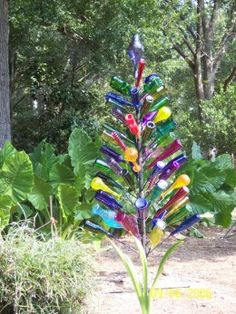 a tree made out of colorful glass bottles