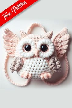 a crocheted owl with big eyes and wings on it's head is shown