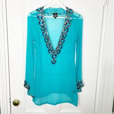 New, Never Worn In Excellent Condition. Zeugari 100% Silk Turquoise Beaded Embellished Resort Wear Swimsuit Coverup. Long Bell Sleeve With Additional Beading At Wrists. Size Small, Please Note All Measurements Are Approximate: - Pit To Pit: 17 Inches - Length: 32 Inches Reasonable Offers Are Always Welcome! Bundle With Other Items In My Closet And Save Tags: Spring Break, Summer, Pool, Swimming, Beach, Vacation, Holiday, Island, Resort, Bejeweled, Iridescent, Boho, Bohemian Blue V-neck Kaftan For Party, Blue Embellished Kaftan For Party, Embellished Blue Kaftan For Party, Blue Sequined Party Kaftan, Blue Sequined Kaftan For Party, Beach Long Sleeve Embellished Kaftan, Long Sleeve Beachwear Kaftan For Party, Long Sleeve Embellished Kaftan For Beach, Embellished Long Sleeve Kaftan For The Beach