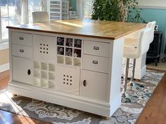 a kitchen island made out of cabinets and drawers