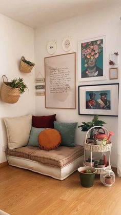 a living room filled with lots of furniture and pictures on the wall above it's couch