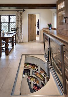 a kitchen with a hole in the floor that is filled with food