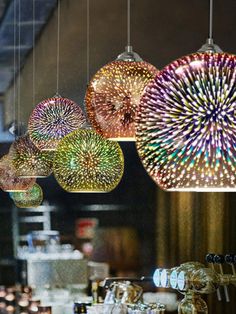 colorful lights hanging from the ceiling in a store