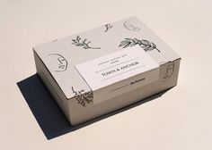 a box with a label on it that says town and anchor in front of a white background