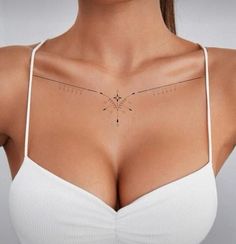 a woman's breast with an arrow tattoo on her left side and the other part of her chest