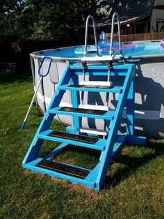 an above ground swimming pool with ladders