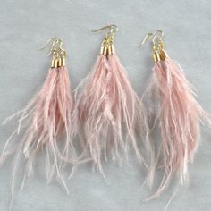 These elegant feather earrings are perfect for a wedding or any night out!+ lightweight pale pink ostrich feathers+ gold-plated stainless steel ear wire hooks (lead-free and nickel-free)+ comes with plastic earring back for security+ approximately 5-6 inches long   (each piece is handmade so lengths are approximate)+ packaged on a hand-stamped kraft earring card in a clear resealing bag making them ready for gift givingMORE FEATHER EARRINGSTo see all the Libby & Smee feather earrings: http://ets Elegant Feather Dangle Earrings, Elegant Dangle Feather Earrings, Elegant Dangle Earrings With Feathers, Elegant Feather Earrings For Gift, Bohemian Feather Earrings For Party, Elegant Adjustable Feather Earrings, Elegant Pink Fringe Jewelry, Elegant Feather Earrings, Pink Ostrich Feathers