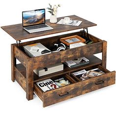 a wooden desk with drawers and a laptop on top