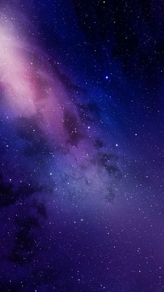 the night sky is filled with stars and purple hues, as well as dark clouds