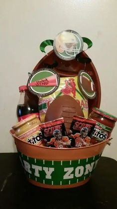 a football themed gift basket is displayed on a table