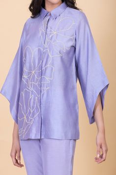 Lilac concealed placket shirt with abstract flower embroidery. Comes with pant.
Components: 2
Pattern: Embroidery
Type Of Work: Flower
Neckline: Collar
Sleeve Type: Bell
Fabric: All weather pure silk
Color: Purple
Other Details: 
Hand-spun and handwoven
Weight (in kgs): 0.8
Shirt:
Shirt collar with hidden placket
Pant:
Elasticated back with a concealed drawstring in the front
Straight silhouette
Ankle length
Occasion: Work - Aza Fashions Lunch Dresses, Co Ords Outfits, Embellished Shirt, Mens Fashion Wear, Crochet Hair Accessories, A Line Kurta, Casual Wear Dress, Shirt Pant Set, Smart Dress