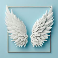 white wings on a blue background in a square frame with gold trim around the edges