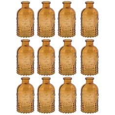 six antique glass bottles with carved designs on them