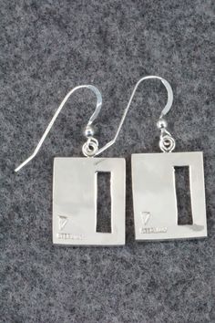 These sterling silver earrings are made by Hopi silversmith Timothy Mowa. The backs are signed and stamped sterling.Length: 1 3/8"Width: 5/8"Free shipping on all orders! We ship with USPS and always include tracking. All orders ship within a day of payment.Returns are accepted up to 30 days after you receive your order. Just send us a message. Our shop offers cash back or store credit. The item must be returned in new condition. Nickel-free Rectangular Sterling Silver Earrings, Unique Sterling Silver Rectangular Earrings, Fairy Land, Native American Jewelry, Free Jewelry, Sterling Silver Earrings, Silver Earrings, Place Card Holders, Stamp