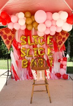 a slice of pizza themed birthday party with balloons