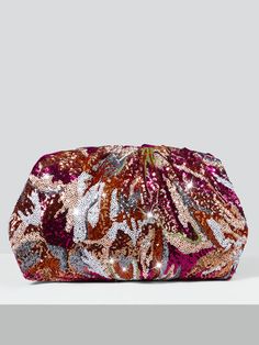 In stock and ready to ship in 1-2 business days. This chic and versatile clutch features a mesmerizing array of multicolored sequins on the front, creating a stunning visual effect that catches the light and captures attention. The back is crafted from luxurious velvet in a gorgeous shade of fuchsia, adding a soft and tactile element to the design. Inside, you'll find a convenient zip pocket, providing a secure space for your essentials. Measurements: 14.17 IN/36 CM (L) x 1.57 IN/4 CM (W) x 7.87 Velvet Clutch Bag, Multicolor Sequins, Velvet Clutch, Visual Effects, Accessories Shop, Clutch Bag, Zip Pockets, Sequin, Velvet