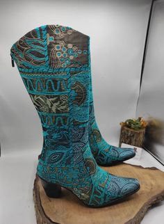 Hi, These are handmade genuine leather custom made cowboy style women's boots. Made with naturel leather, chenille fabric, ykk zipper. There is every size is available, 6 us to 11 us, 36 eu to 43 eu. There is heel 1 inches, 2.5 cm. ** If you need wider calf pleasse send us your calf circle measurments. To make custom order no extra charging. Boots height is knee high. There is ethnic pattern on turquoise boots. Waterproof. Very comfy and useful. We have door to door express shipping service. İf Blue Bohemian Festival Boots, Western Style Blue Festival Boots, Handmade Bohemian Boots For Fall, Blue Western Festival Boots, Blue Western Style Festival Boots, Handmade Bohemian Festival Boots, Bohemian Snip Toe Boots For Festival, Bohemian Blue Boots With Round Toe, Bohemian Snip Toe Festival Boots