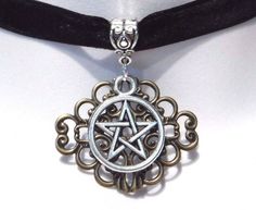 "Narrow black velvet band with silver pentagram pendant in front of bronze damask stamping. choker adjusts between about 13.5 to 15\", so best for necks under 14.5\"." Silver Halloween Festival Choker, Silver Choker For Halloween Festival, Halloween Festival Silver Choker, Gothic Gold Choker For Festivals, Bronze Adjustable Choker, Adjustable Gothic Choker For Festivals, Adjustable Black Steampunk Choker, Gothic Silver Choker As A Gift, Gothic Silver Choker For Gift