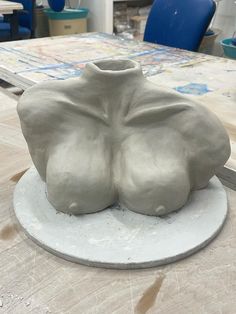 there is a sculpture on the table that looks like it's made out of clay