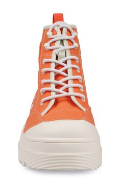 Crisp contrast stitching and a rubberized patch add signature charm to this canvas high-top sneaker grounded on a chunky platform sole. 2" heel; 1" platform 4" shaft Water-resistant Textile upper/leather lining/rubber sole Imported High Top Sneaker, Chunky Platform, Contrast Stitch, Contrast Stitching, High Top, High Top Sneakers, Rubber Sole, Stitching, Water Resistant