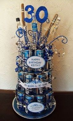 a birthday cake made out of beer cans with the number 30 on it's top