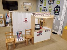 a child's playroom with two wooden chairs