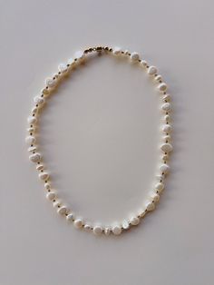 Rondelle Pearl Necklace With Pearl Charm As Gift, White Pearl Beaded Necklaces In Rondelle Shape, White Pearl Beaded Necklace In Rondelle Shape, Gift Jewelry With Polished Baroque Pearl Beads, Rondelle Single Strand Pearl Necklace Gift, Rondelle Pearl Necklace With Polished Beads, Single Strand Rondelle Pearl Necklace Gift, Gift Single Strand Rondelle Pearl Necklace, Pearl And Gold Necklace