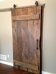 an open wooden door in the corner of a room