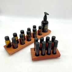 two wooden trays with bottles on top of them and an empty bottle in the middle