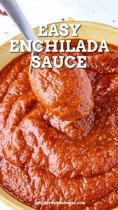 easy enchilada sauce in a yellow bowl with a spoon sticking out of it