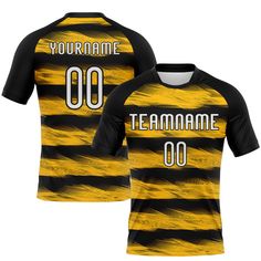 a yellow and black striped soccer jersey with the number 00 on it, in front of white