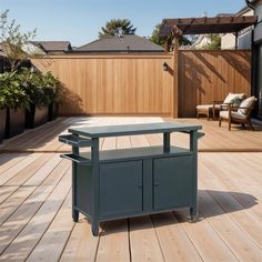 a table on a wooden deck in the middle of a backyard