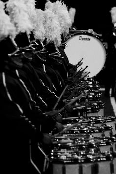 the marching band is lined up and ready for their next drum solo concert to begin