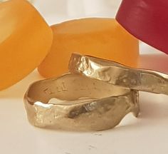 wedding bands his and hers Handmade solid 14k gold faceted bands set. RMG0179- Metal 14K gold- Weight 2.2gr Width, 3.5-4.8 MM Thickness 1mm Price $540 RMG0432- Metal 14K- Weight 1.7 gr, Width-3.2mm, Thickness-1.2mm, Price $420 The price is for both rings Ring size Please send me each ring size at a message 🠺 Wide ring size 🠺 Tin ring size CUSTOMIZATION I can make the rings in any width and gold type (yellow, white or rose) the images can be used as a reference. Yellow Gold Recycled Gold Bands For Gift, Hammered Gold Bands As A Gift, Handmade Yellow Gold Wedding Jewelry, Handmade Gold Bands As Gift, Handmade Yellow Gold Wedding And Anniversary Rings, Handmade Recycled Gold Wedding Rings, Handmade Gold Wedding Bands, Boho Bride And Groom, Wedding Band Hammered