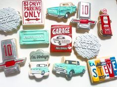 some cookies that are shaped like cars and trucks on top of each other in the shape of magnets