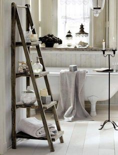 the ladder is leaning against the wall in the bathroom