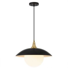 a black and gold pendant light hanging from the ceiling