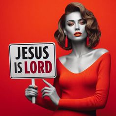 a woman holding a jesus is lord sign in front of her face and wearing red lipstick