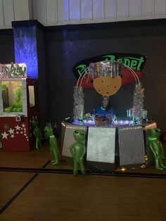 an image of a booth set up for a christmas party with lights and decorations on the table