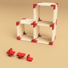 three red and white shelves sitting next to each other on top of a brown floor