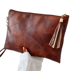 Brand New! Gorgeous Soft Vegan Leather Large Clutch In The Color Cognac. Beautiful Detailing, Tasseled Zipper Closure, Clip-On Wristlet Attachment. Lined. Very Soft And Flexible, Not A Stiff Bag. Approx 10 1/2” X 7 1/2” Everyday Clutch Bag With Tassels, Large Clutch, Ladies Boutique, Clutch Handbag, Cognac, Vegan Leather, Bag Lady, Boutique, Brand New