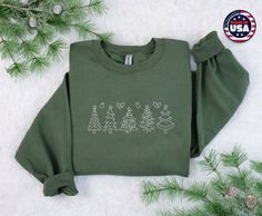 Christmas Tree Embroidered Sweatshirt, Holiday Christmas Family Sweater, Vintage Unisex Comfort Colors Matching Tee Shirt, Christmas Gifts Please note: The 70% discount applies to individual products. To order a set containing "2 items," add each item separately to your cart and proceed to checkout. SPECIFICATIONS: ^ 8-ounce, 50/50 cotton/poly ^ 60/40 cotton/poly (Heather Sports) ^ Double-needle stitching at waistband and cuffs ^ 1x1 rib knit collar, cuffs and waistband with spandex ^ Safety Green is compliant with ANSI/ISEA 107 high-visibility standards ^ Recycled, high-performing black tear-away label For any questions or issues regarding our Etsy listings, please use the Etsy message center to contact us. This way, we can provide you with the best assistance and any additional informati Elf Sweatshirt, Christmas Shirts For Women, Family Sweater, Farm Christmas, Fall Crewneck, Holiday Sweaters, Tree Sweater, Delivery Nurse, Santa Sweatshirt