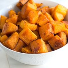 a white bowl filled with cooked sweet potatoes