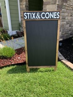 a sign in front of a brick building that says stix & cones on it